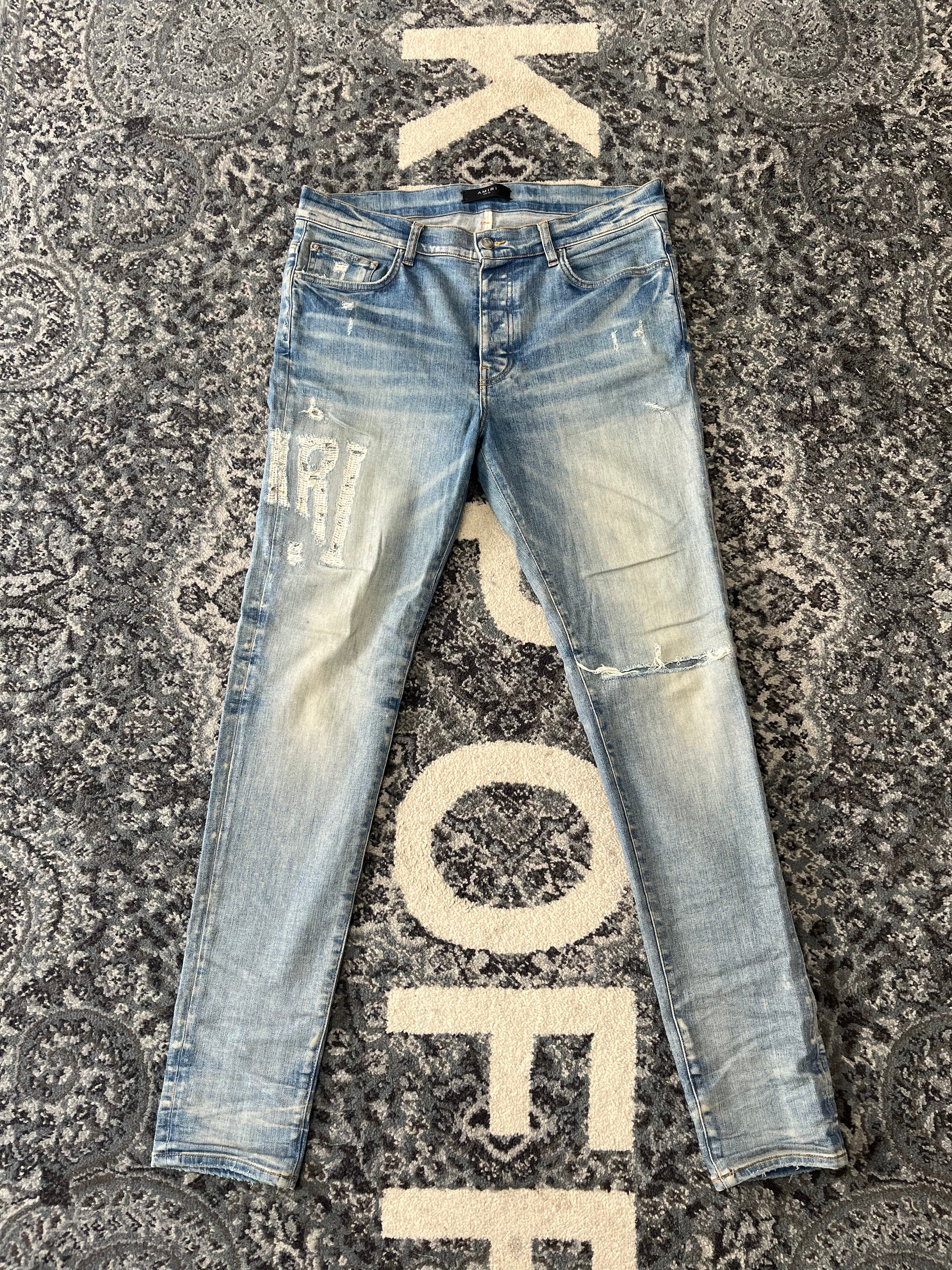 AMIRI distressed side logo jeans indigo 36 U